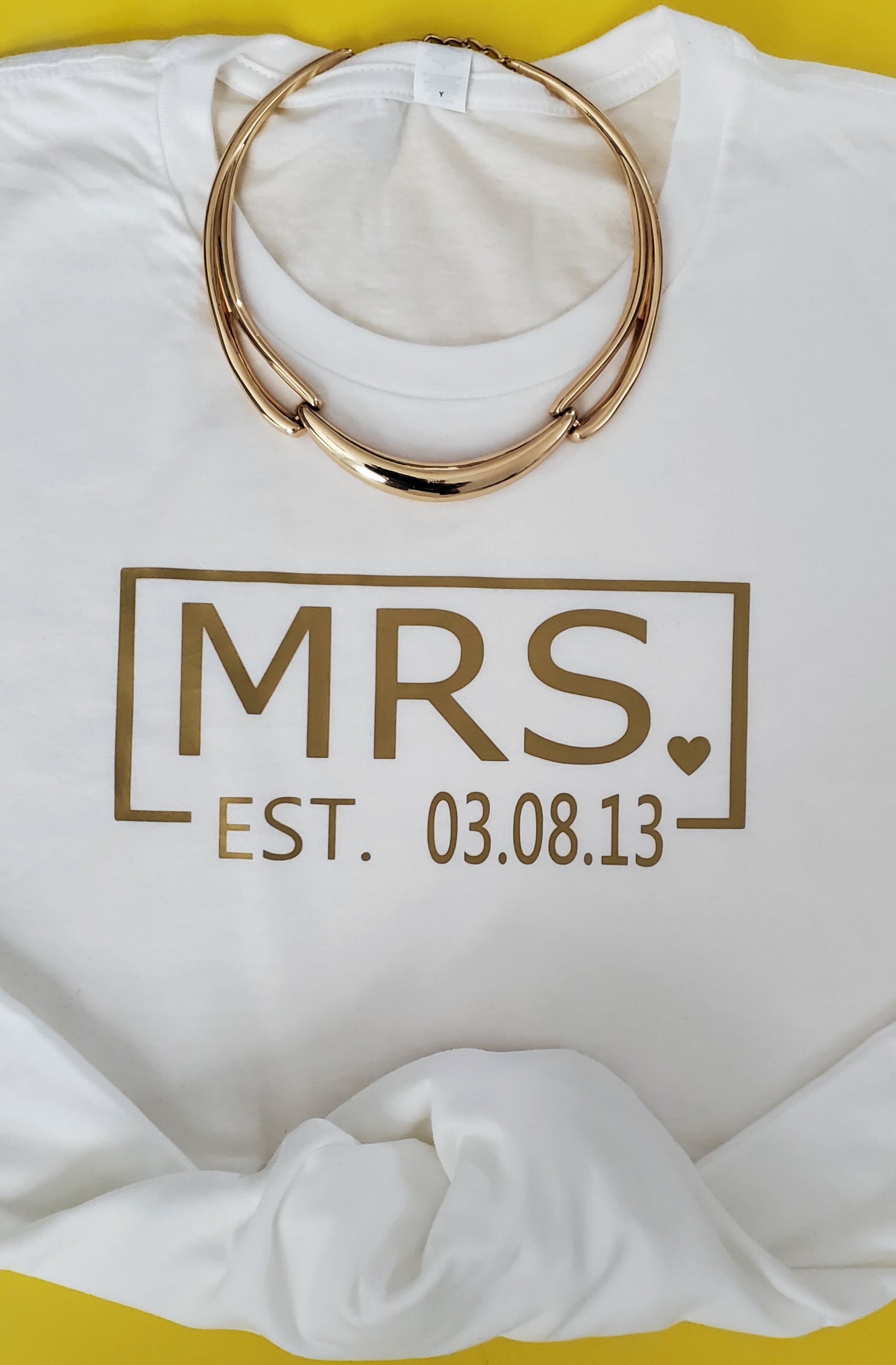 Mr. & Mrs EST Personalized gold print on T-shirt.