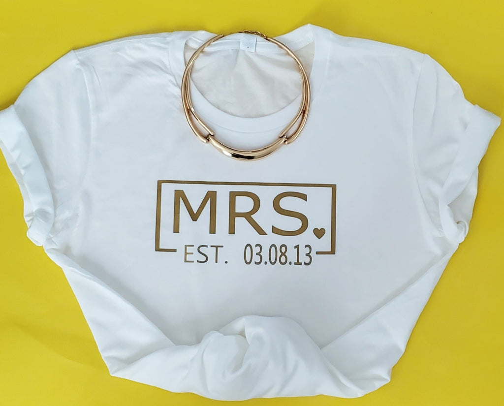 Mr. & Mrs EST Personalized gold print on T-shirt.